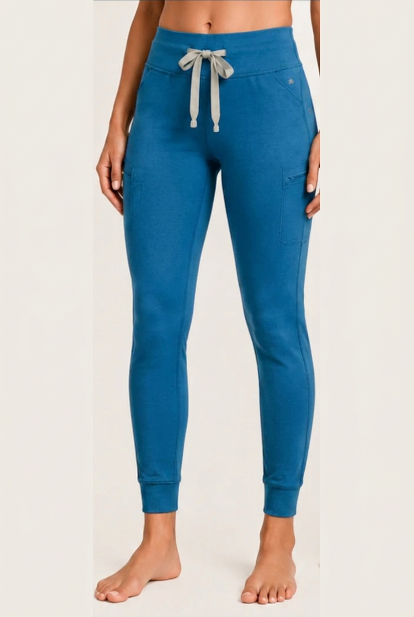 The Clover Legging in Cerulean Blue — high yoga-style waistband, contrasting drawstring, zip thigh pocket and cuffed ankle
