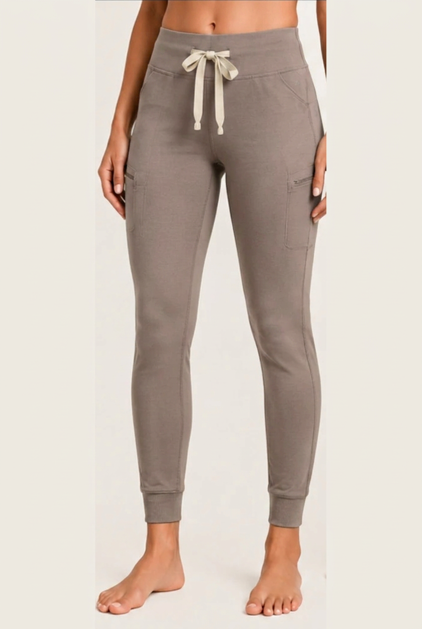 The Clover Legging in Mushroom — high yoga-style waistband, contrasting drawstring, zip thigh pocket and cuffed ankle