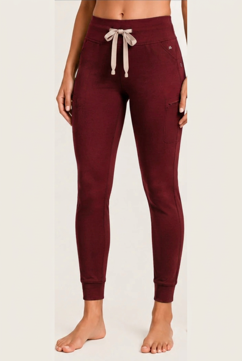 The Clover Legging in Vampire Red — high yoga-style waistband, contrasting drawstring, zip thigh pocket and cuffed ankle
